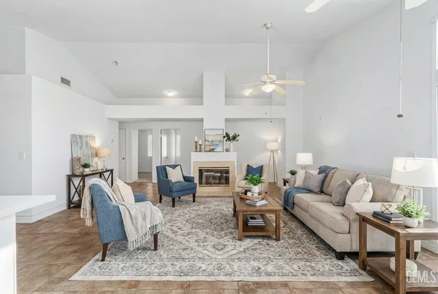 a kitchen with white cabinets sink and stove