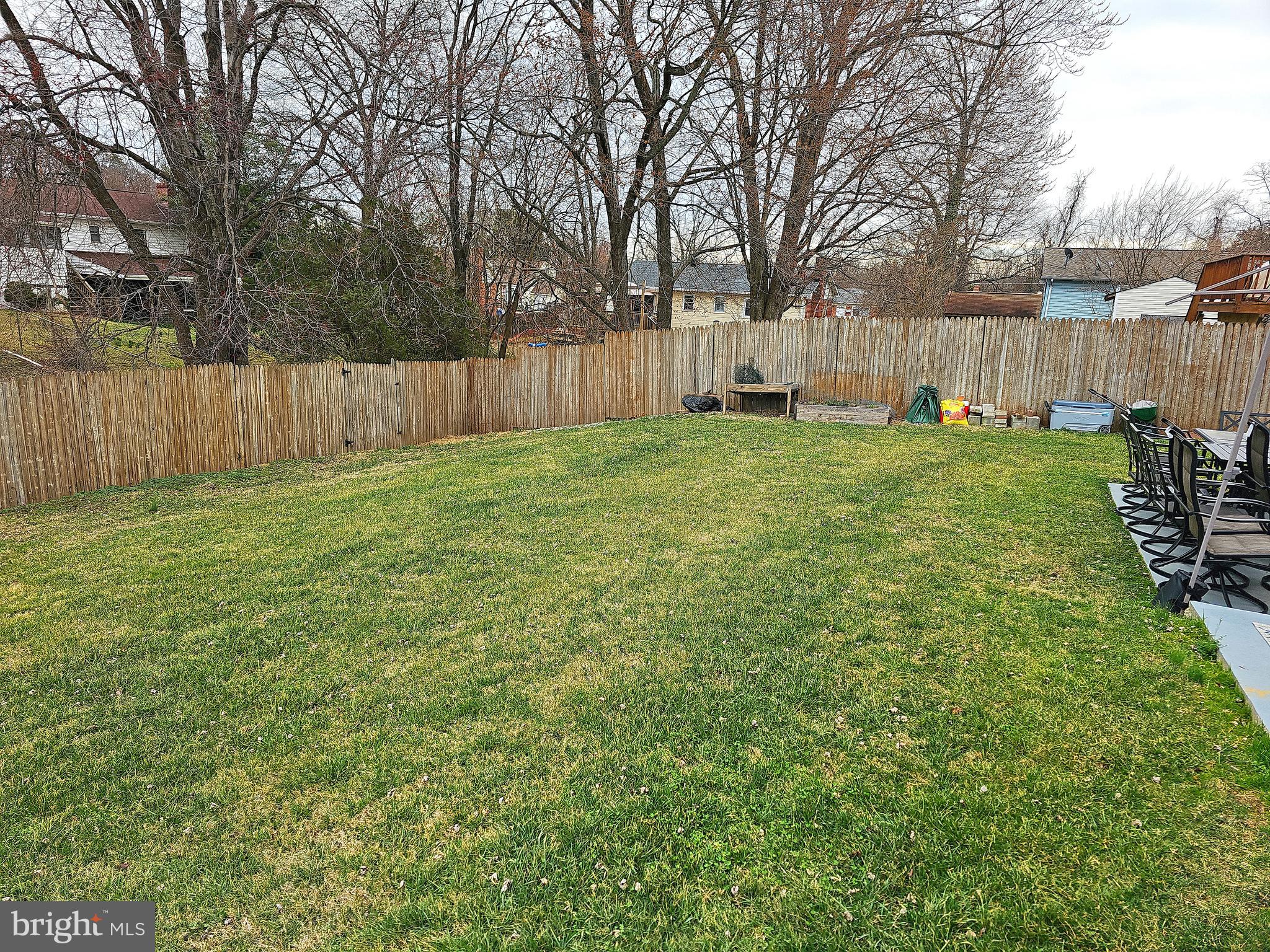 14143 Grayson Road Woodbridge, VA 22191 - Photo 12 of 58 Very large fenced backyard. Slopes away from home.