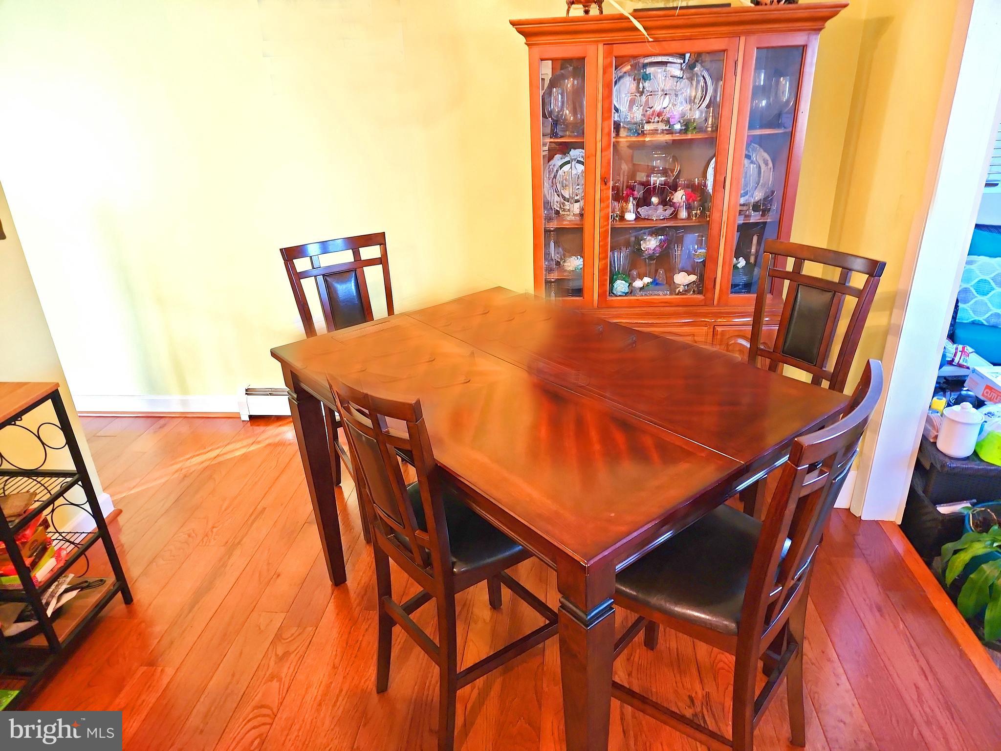 14143 Grayson Road Woodbridge, VA 22191 - Photo 24 of 58 Open Dining Room. Table easily fit 6 chairs.