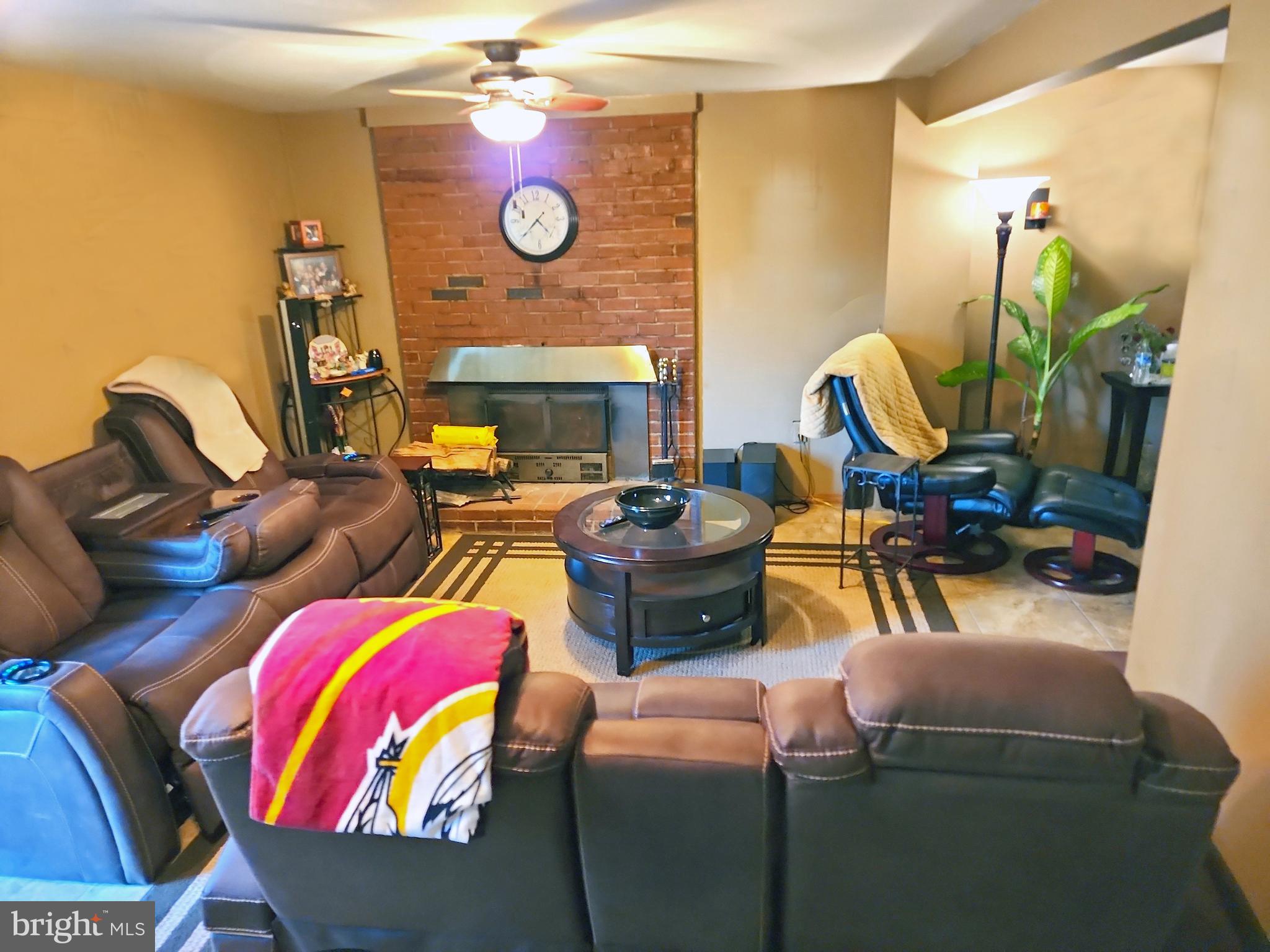 14143 Grayson Road Woodbridge, VA 22191 - Photo 50 of 58 Family Room, downstairs w/ wood burning fireplace