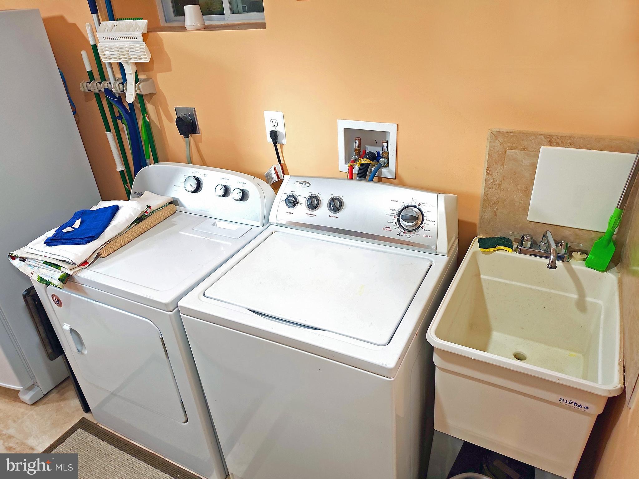 14143 Grayson Road Woodbridge, VA 22191 - Photo 58 of 58 Full size washer and dryer. With sink.