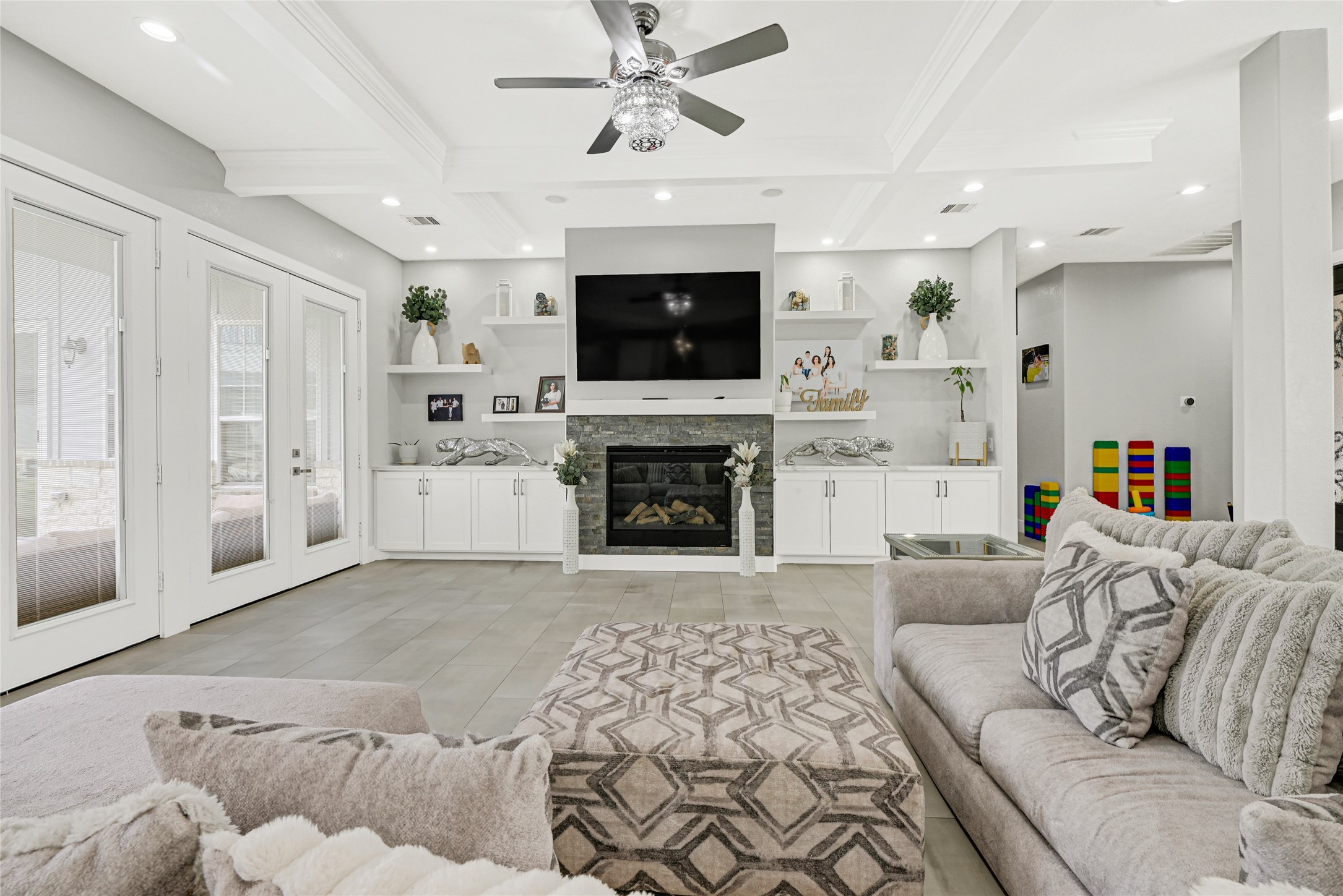 4821 1st Street Houston, TX 77504 - Photo 6 of 48 a living room with furniture a flat screen tv and a fireplace