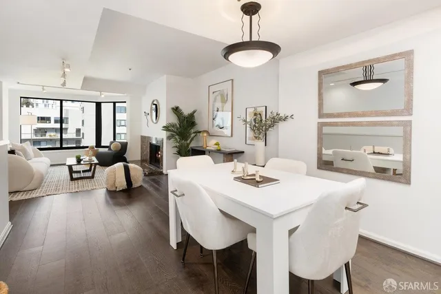 a view of a dining room with furniture window and wooden floor