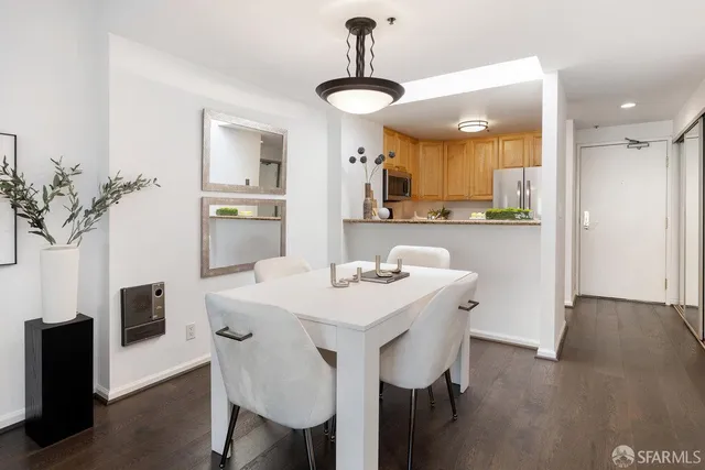 a view of a dining room with furniture and wooden floor