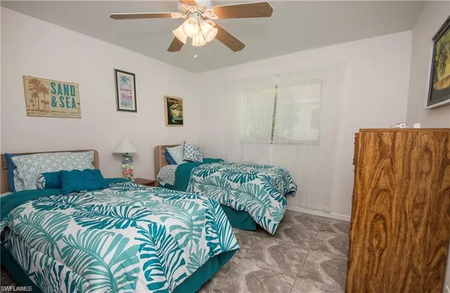 a bedroom with double bed and a window