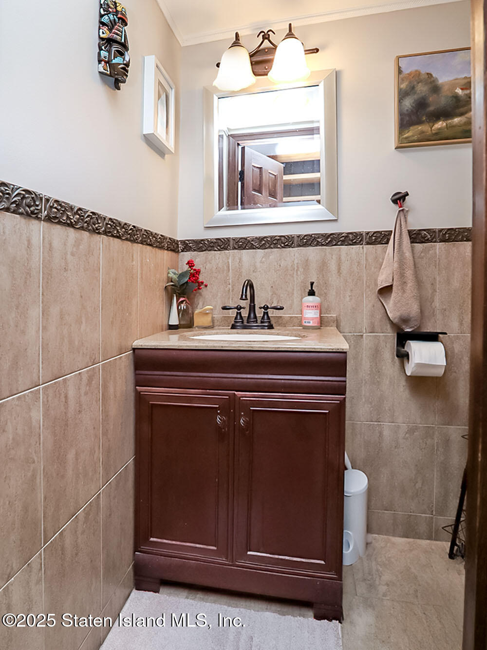 31 Pierpont Place Staten Island, NY 10314 - Photo 12 of 23 a bathroom with a sink a toilet and mirror