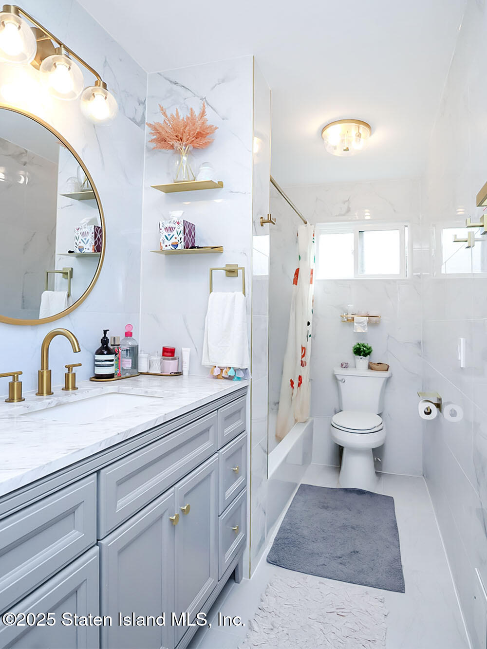 31 Pierpont Place Staten Island, NY 10314 - Photo 16 of 23 a bathroom with a sink a toilet and a mirror