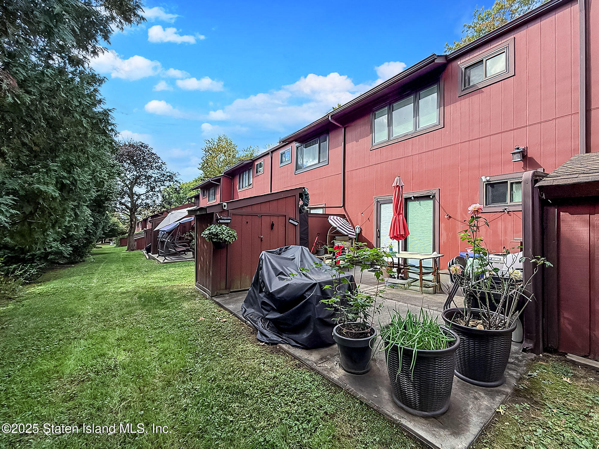 31 Pierpont Place Staten Island, NY 10314 - Photo 20 of 23 a view of a house with backyard sitting area and garden