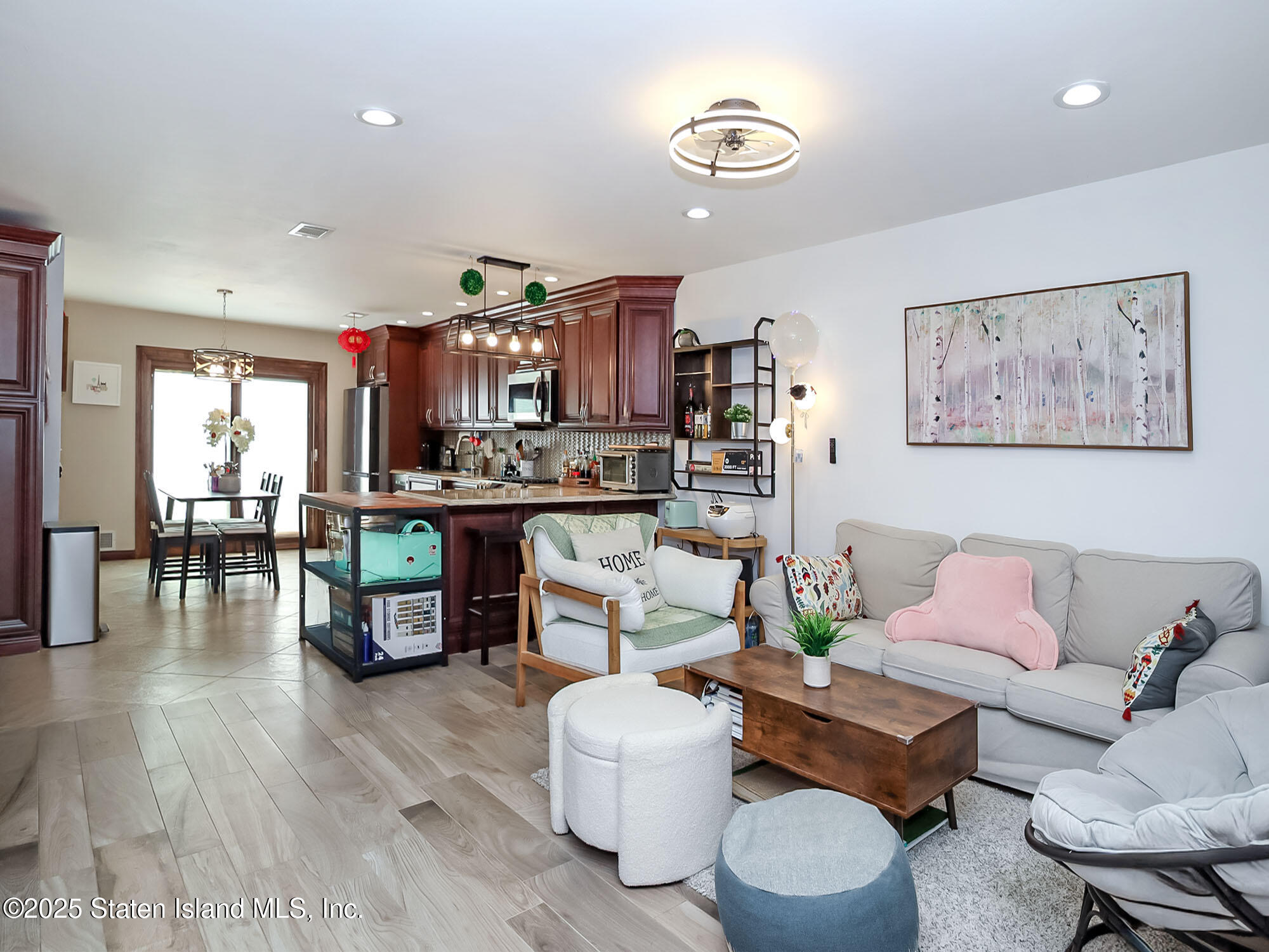 31 Pierpont Place Staten Island, NY 10314 - Photo 2 of 23 a living room with furniture and a wooden floor