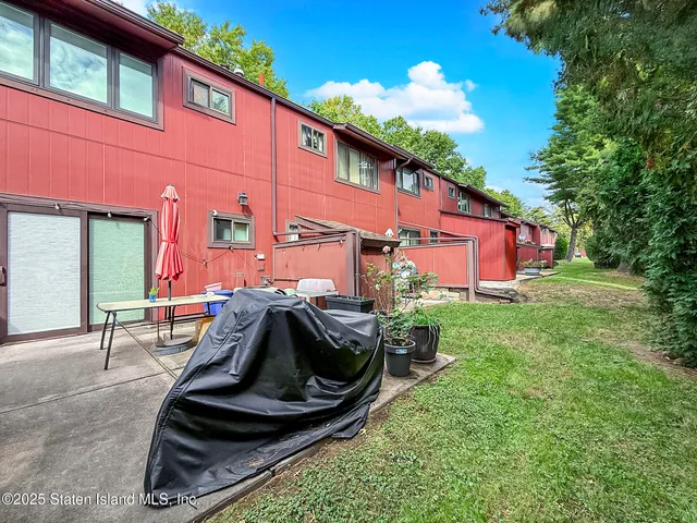 a view of backyard with outdoor seating