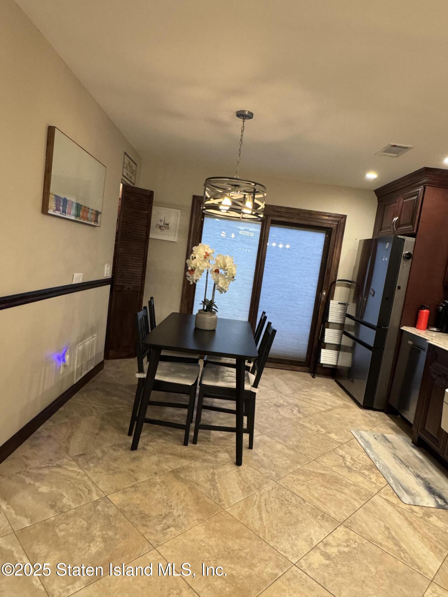 31 Pierpont Place Staten Island, NY 10314 - Photo 5 of 23 a bedroom with furniture and a bed