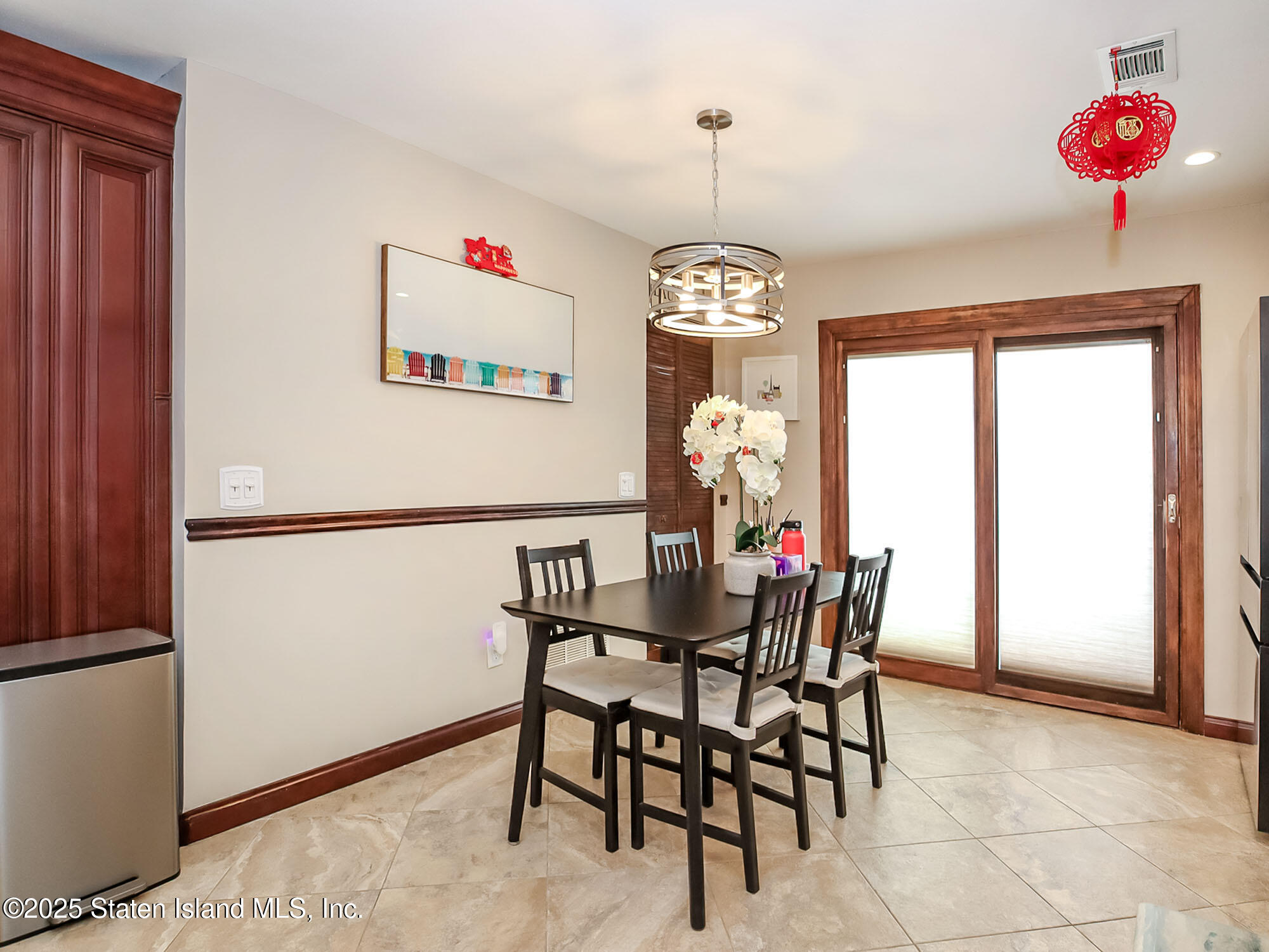 31 Pierpont Place Staten Island, NY 10314 - Photo 10 of 23 a view of a dining room with furniture and chandelier