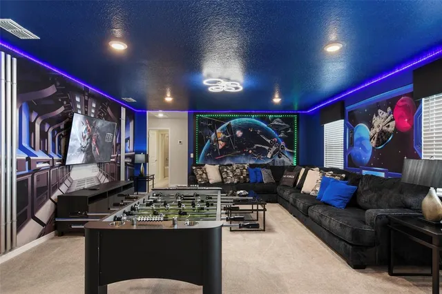 a living room with fireplace furniture and a flat screen tv