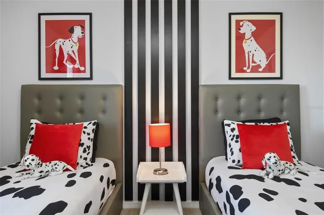 a living room with furniture and a painting on the wall