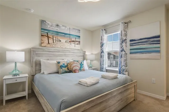 a view of a white house with a yard