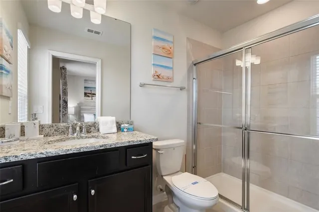 a view of a chairs and table in the patio