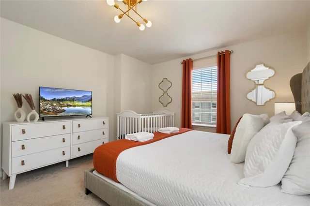 a view of a cafe with a table and chairs under an umbrella