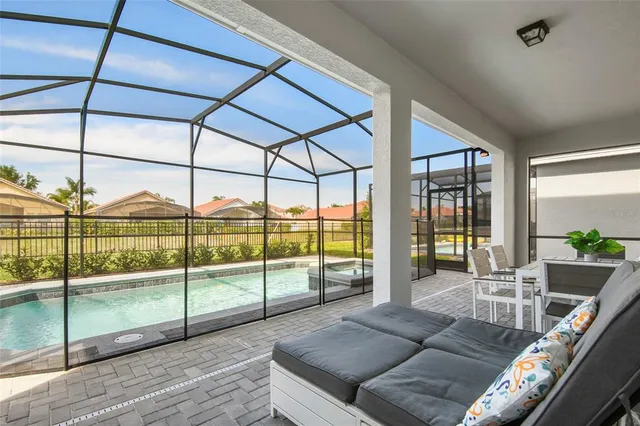 a view of a hallway with wooden floor and entryway