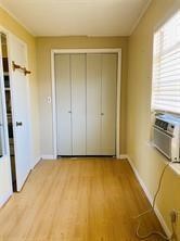 1220 Winnie Rear Street Galveston, TX 77550 - Photo 6 of 10 a view of a room with a wooden floor and a sink