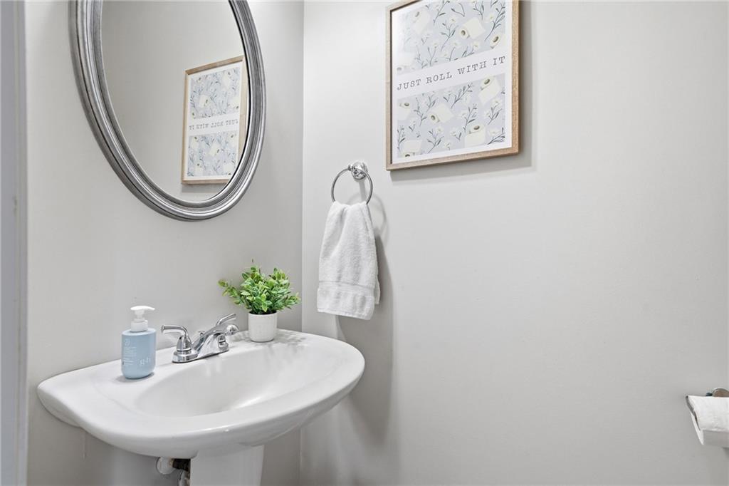 615 Myers Gate Road Ball Ground, GA 30107 - Photo 19 of 43 a bathroom with a sink and a mirror