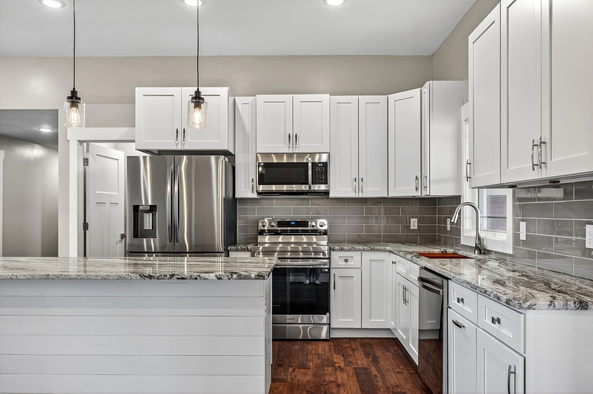 196 Dairy Barn Road Sparta, TN 38583 - Photo 13 of 44 a kitchen with stainless steel appliances kitchen island granite countertop a stove and a refrigerator