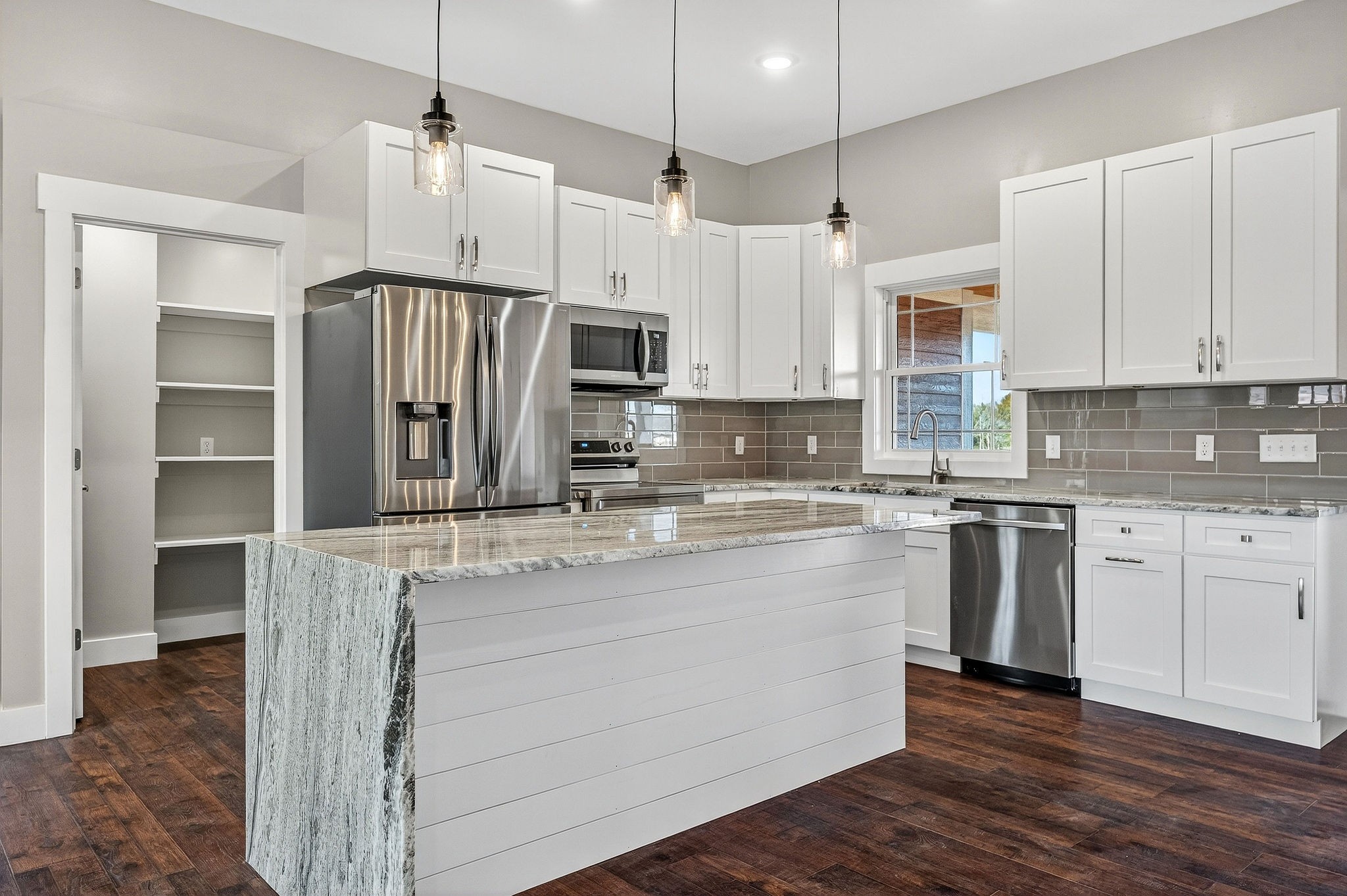 196 Dairy Barn Road Sparta, TN 38583 - Photo 14 of 44 a kitchen with stainless steel appliances granite countertop a sink stove and refrigerator