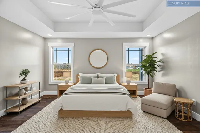 a bedroom with a bed a potted plant and a couch