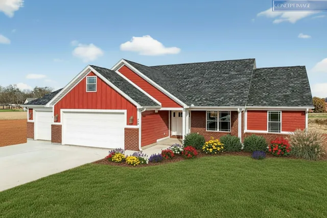 a front view of house with yard and green space