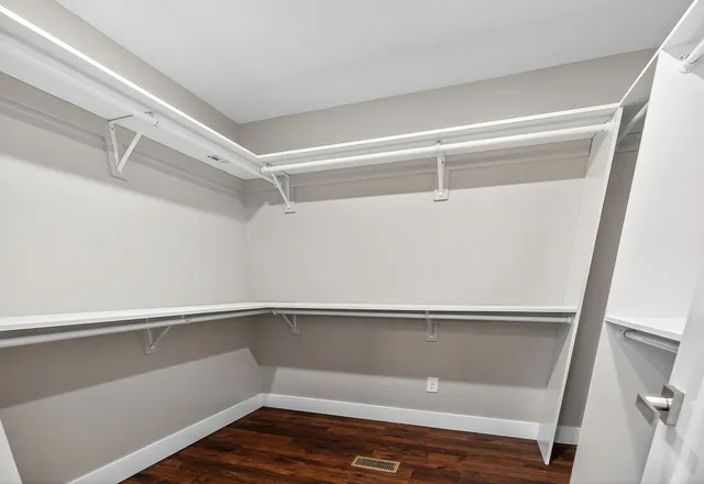 a view of an empty walk in closet