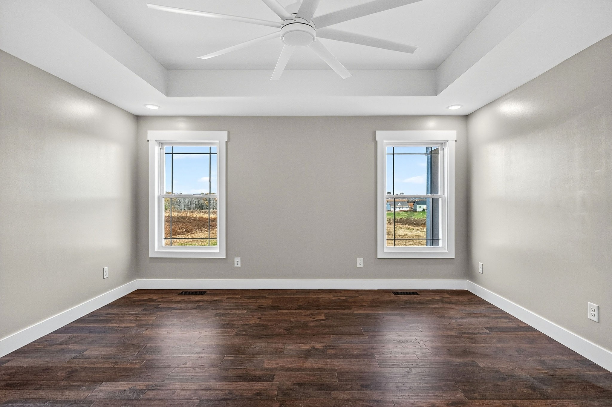 196 Dairy Barn Road Sparta, TN 38583 - Photo 31 of 44 an empty room with wooden floor and windows