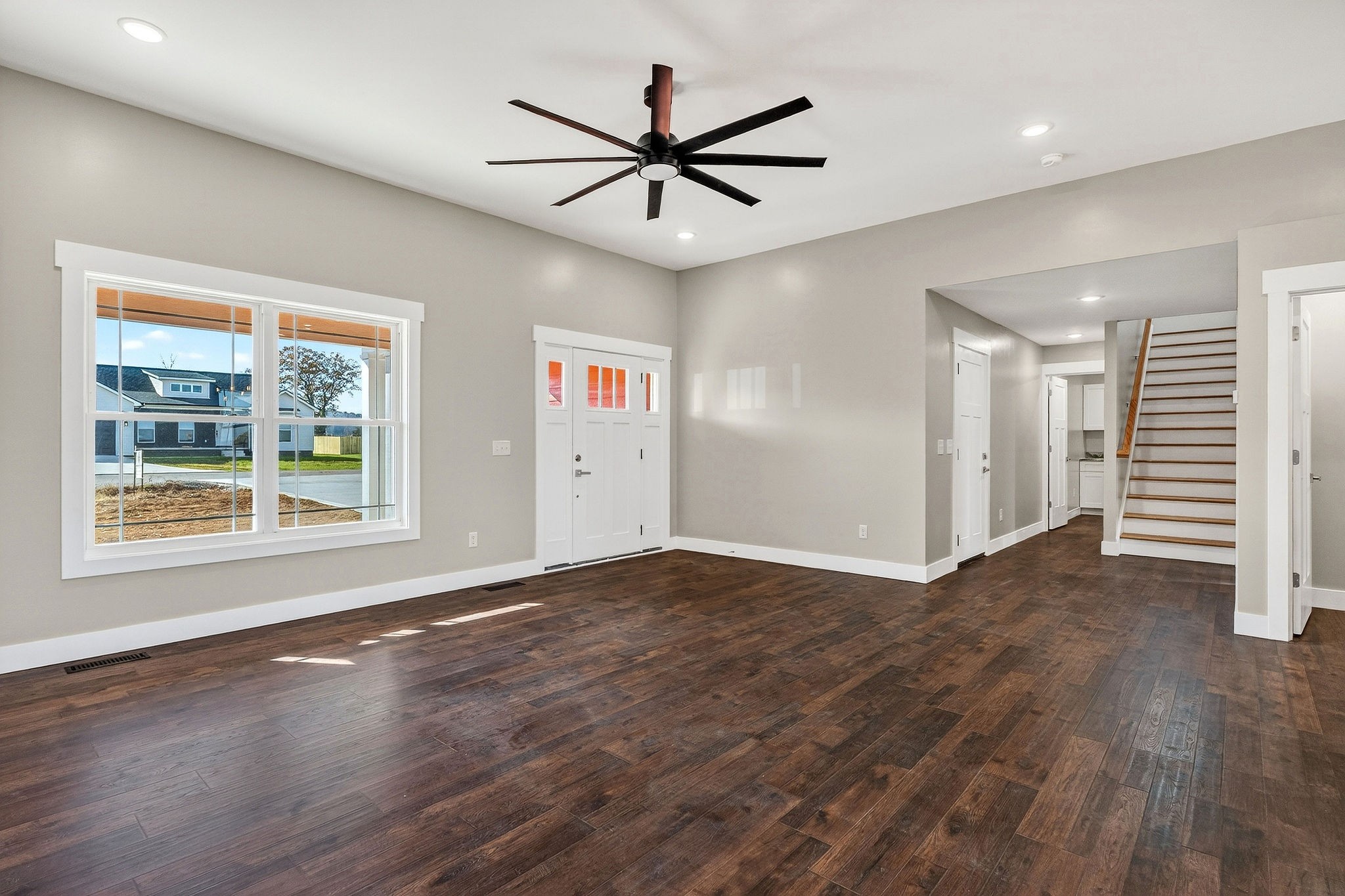 196 Dairy Barn Road Sparta, TN 38583 - Photo 32 of 44 a view of a livingroom with a ceiling fan and wooden floor