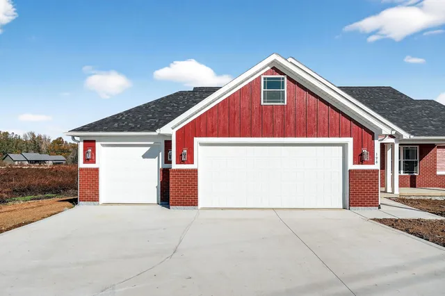 a front view of a house with a garage