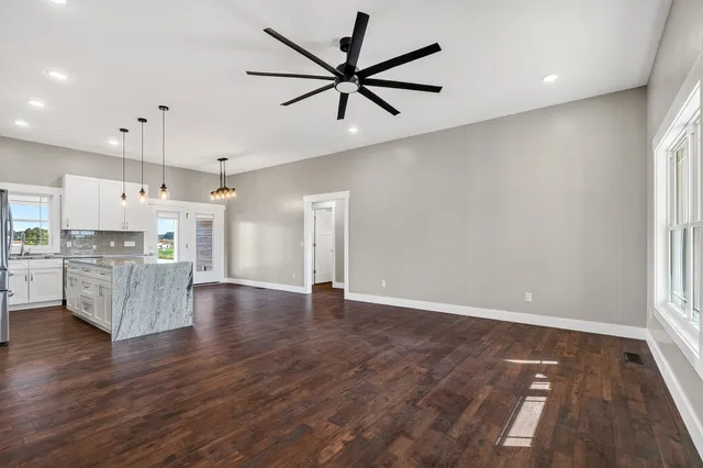 a view of kitchen with furniture and wooden floor