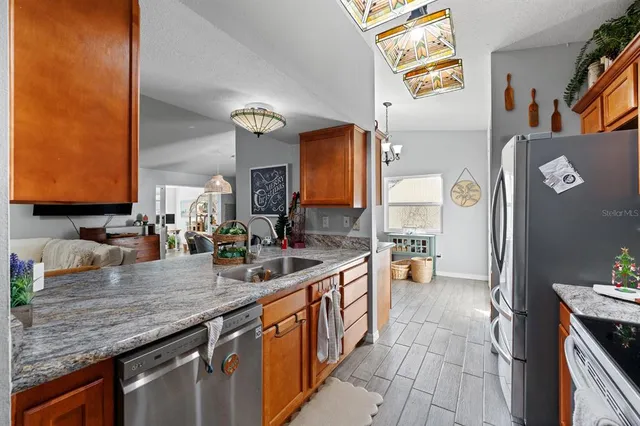 a large kitchen with a counter space and a sink