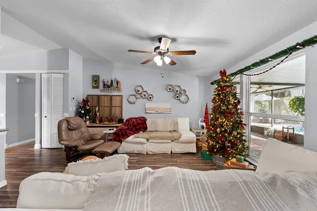 a living room with furniture and a christmas tree