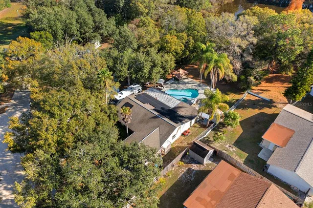 an aerial view of a house with a yard