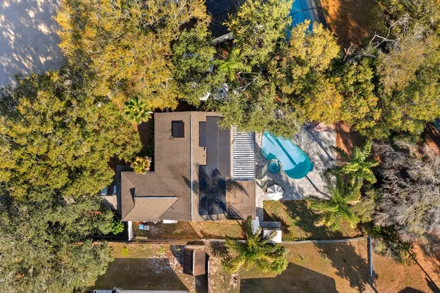 front view of a house with a tree