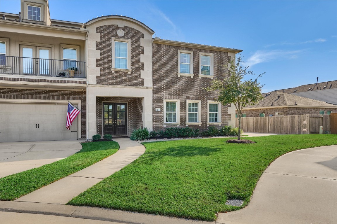 2113 Solstice Boulevard Spring, TX 77386 - Photo 1 of 50 a front view of a house with a garden and yard