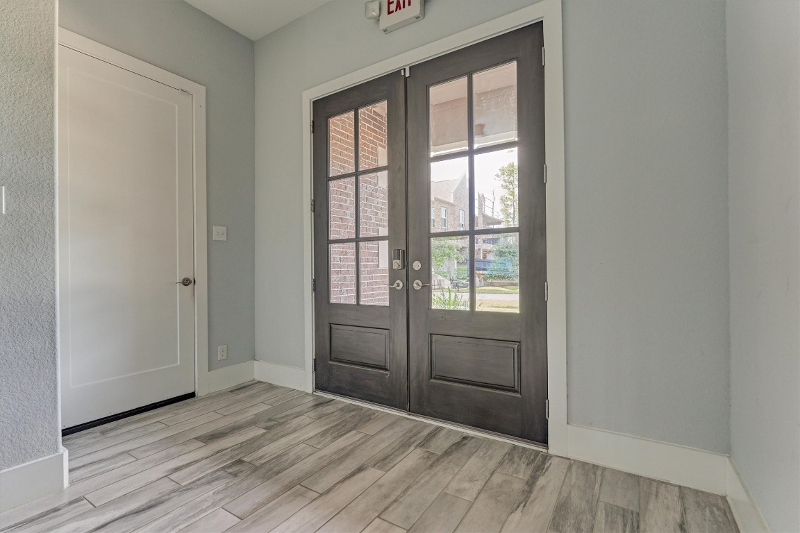 2113 Solstice Boulevard Spring, TX 77386 - Photo 12 of 50 an empty room with wooden floor and windows