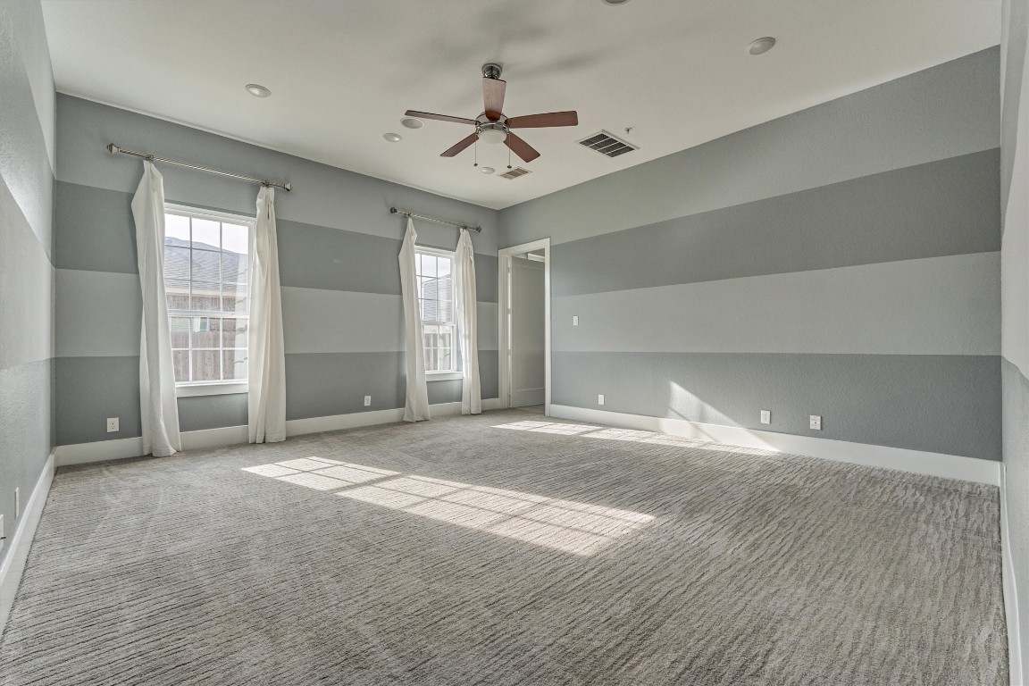 2113 Solstice Boulevard Spring, TX 77386 - Photo 28 of 50 a view of a livingroom with a ceiling fan window and wooden floor