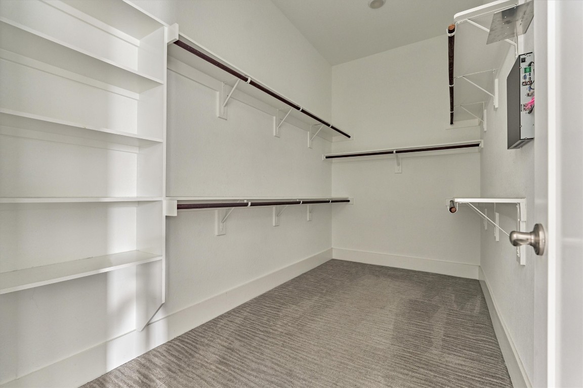 2113 Solstice Boulevard Spring, TX 77386 - Photo 33 of 50 a view of walk in closet with empty racks