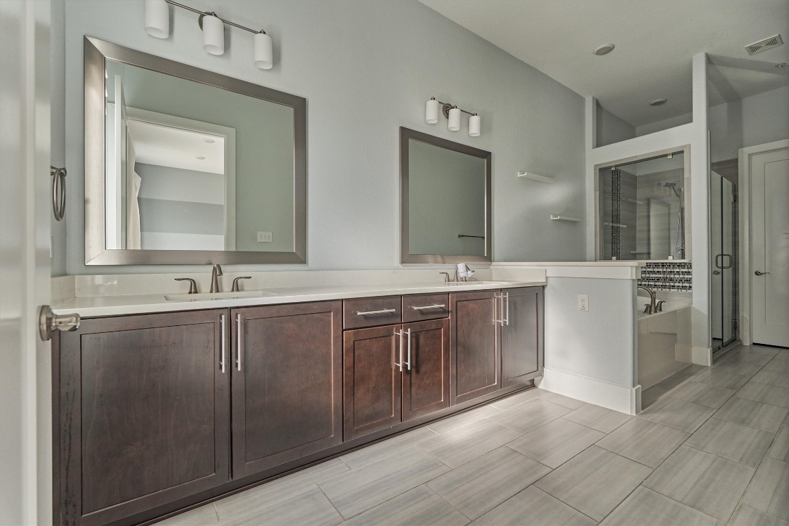 2113 Solstice Boulevard Spring, TX 77386 - Photo 4 of 50 a bathroom with a double vanity sink mirror and