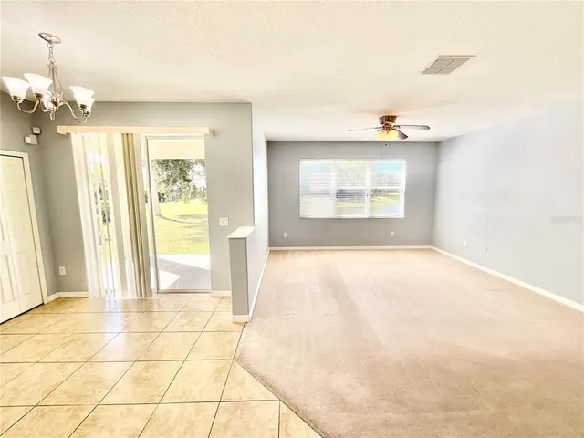 a view of an empty room with glass door
