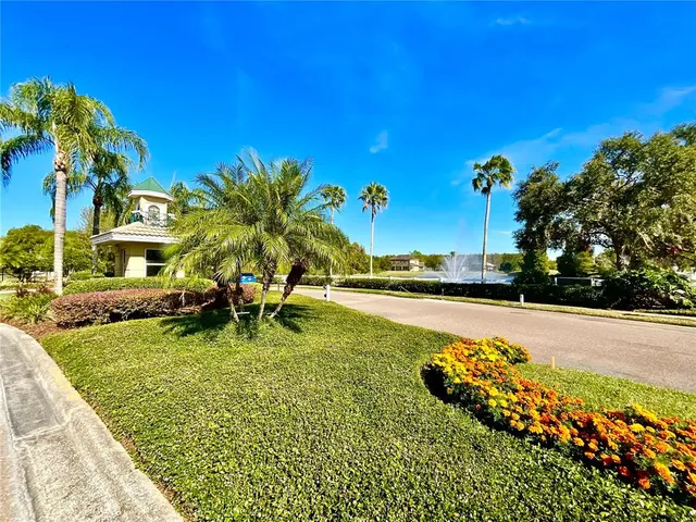 a view of a lake with a house in the background