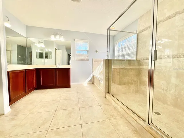 a bathroom with a shower and a tub