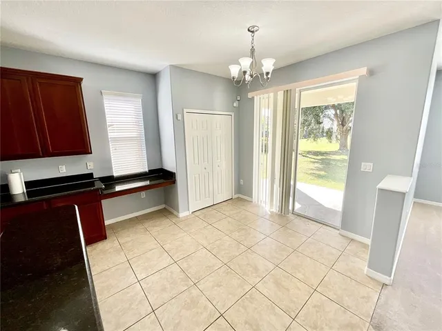 a view of a livingroom with a furniture wooden floor and window
