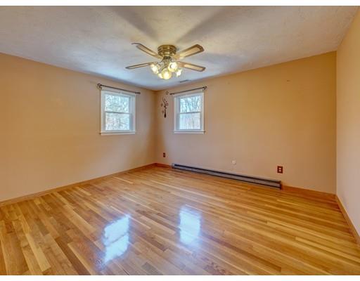 105 Hartness Road Sutton, MA 01590 - Photo 11 of 20 a view of an empty room with wooden floor and a window