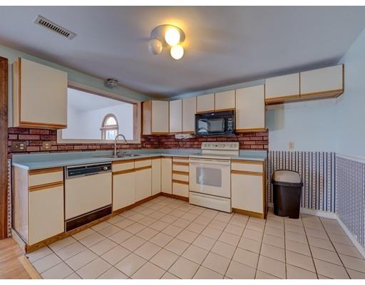 105 Hartness Road Sutton, MA 01590 - Photo 4 of 20 a kitchen with granite countertop a stove sink and cabinets