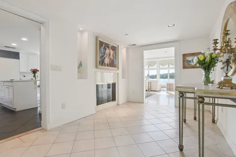 a view of kitchen with furniture and refrigerator