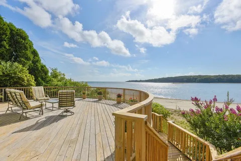 a view of balcony with wooden floor